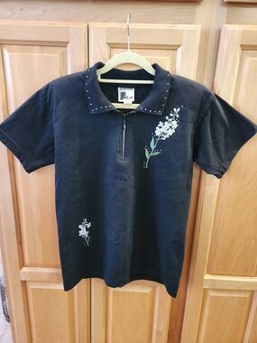Women's Black Knit Shirt with White Floral Accent
